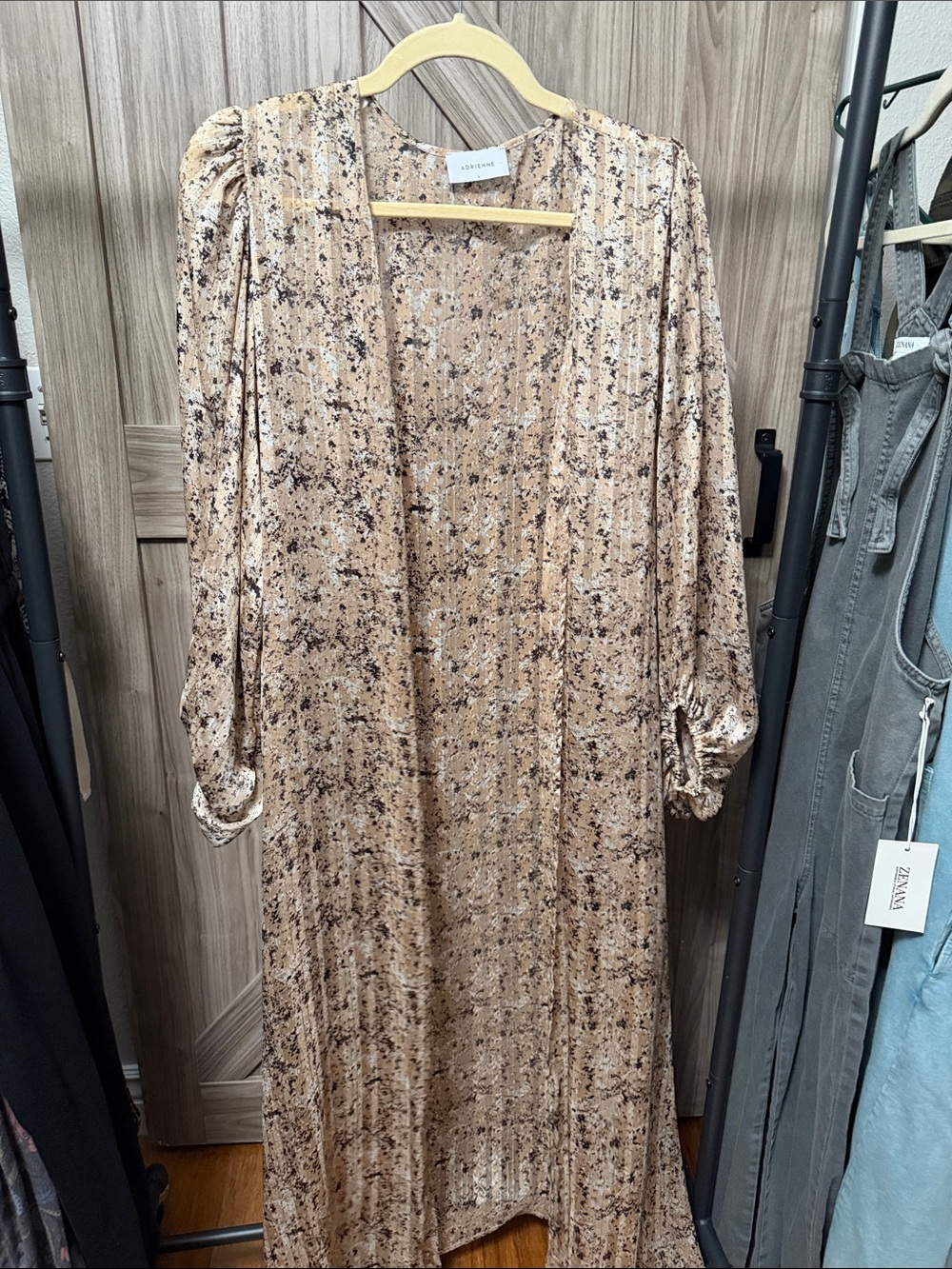 Beautiful Adrienne long sleeve maxi dress in a tan, cream, black, and gray abstr